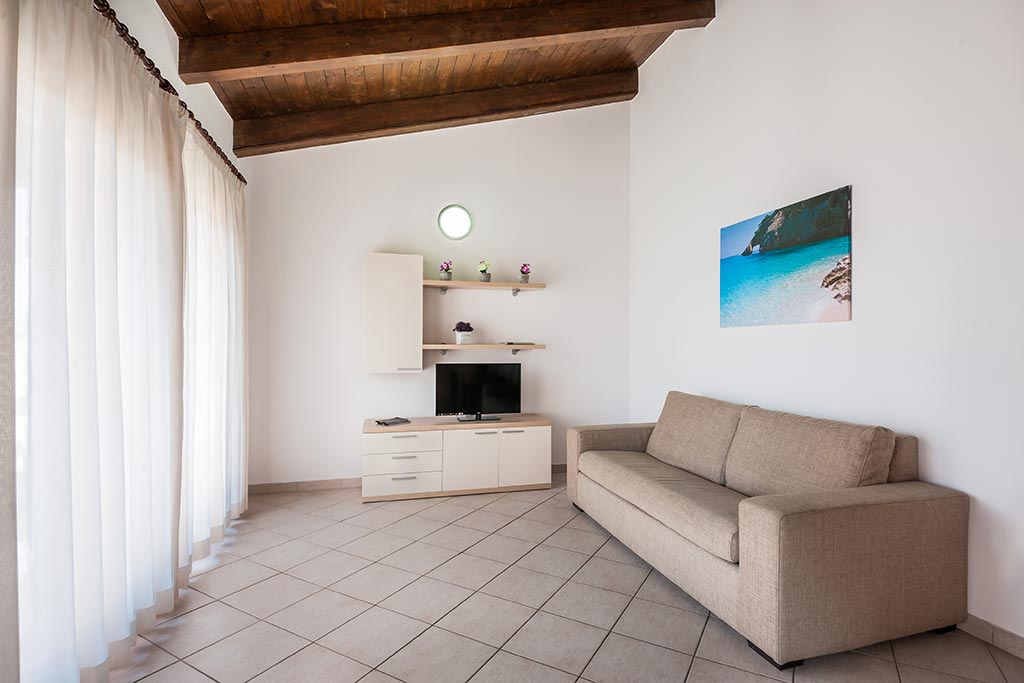 Gravina Resort, ville e case vacanza per famiglie in Sardegna settentrionale, salotto in appartamento